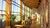 A hospital lobby with big windows and warm evening sun shining in.